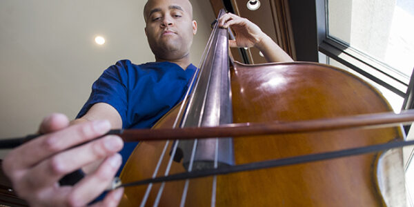 Talon Davis plays the double bass on the 17th floor of Roberts Hospital at Baylor University Medical Center at Dallas.