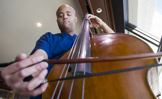 Talon Davis plays the double bass on the 17th floor of Roberts Hospital at Baylor University Medical Center at Dallas.