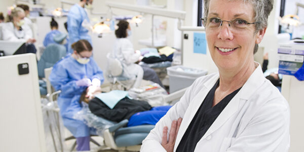 Laura Gene Utt, clinical assisttant professor in dental hygiene, in the college's third floor general dentistry clinic