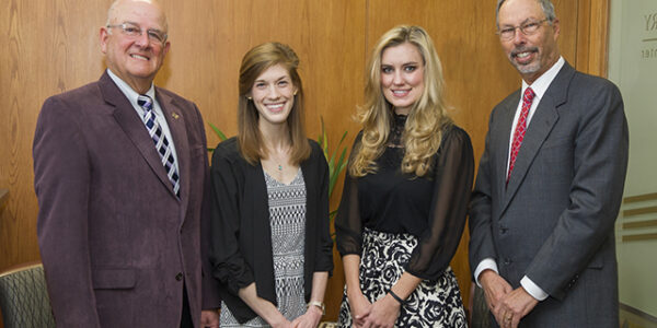 L to R: TDA Smiles Foundation board member, D1 Lauren Brubaker, D1 Tianne Yarbrough, Dean Lawrence Wolinsky