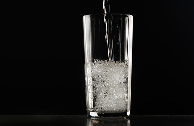 A water glass filled with water