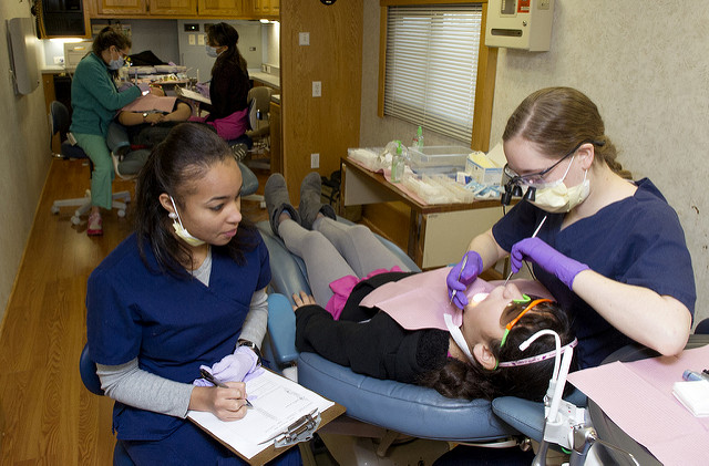 Students treat patients at Give Kids a Smile.