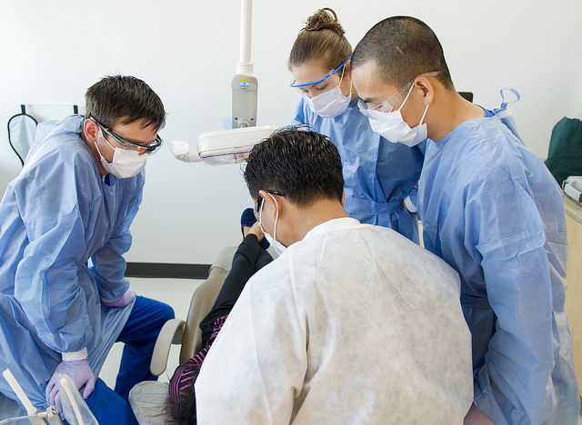 Dr. Don Le instructs students in the Urgent Care Clinic at the University of Texas School of Dentistry at Houston. 