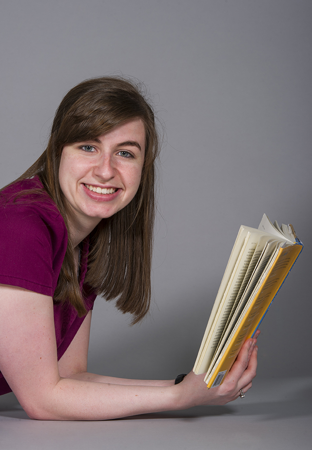 Briana Bonney, first-year dental hygiene student, with the book "Born to Run"