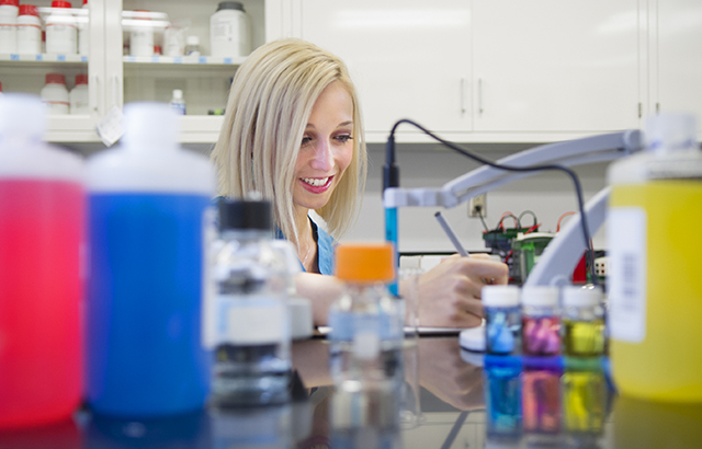Second-year dental student Christina Barry, one of TAMBCD's predoctoral student research fellows, works in the lab.