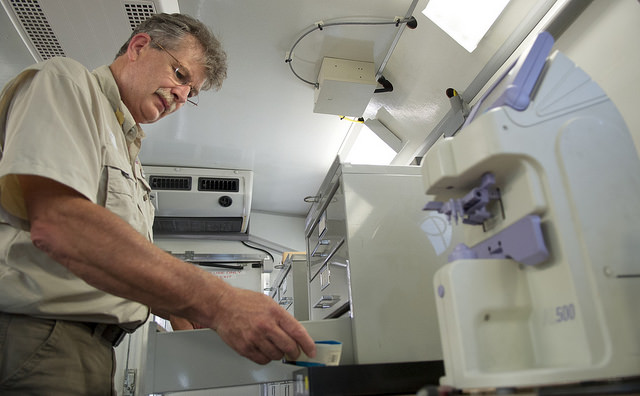 Jeff Eastman, Remote Area Medical Employee and volunteer, prepares a set of lenses in the vision truck.