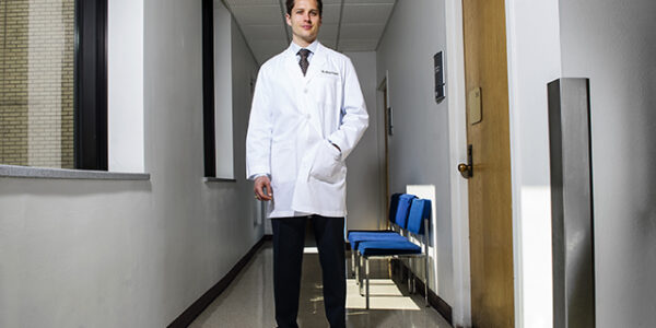 Dr. Chad Capps stands in one of the hallways of the dental school