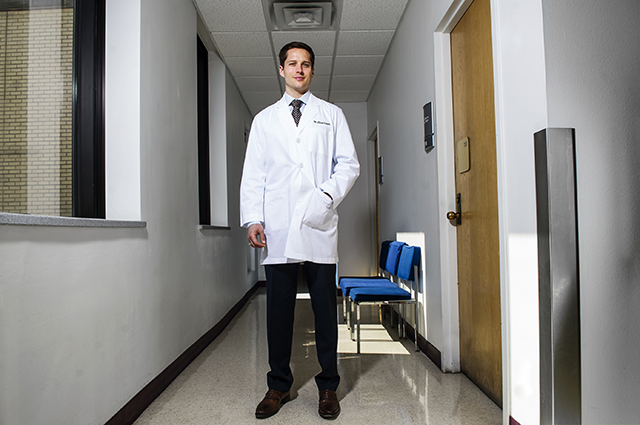 Dr. Chad Capps stands in one of the hallways of the dental school