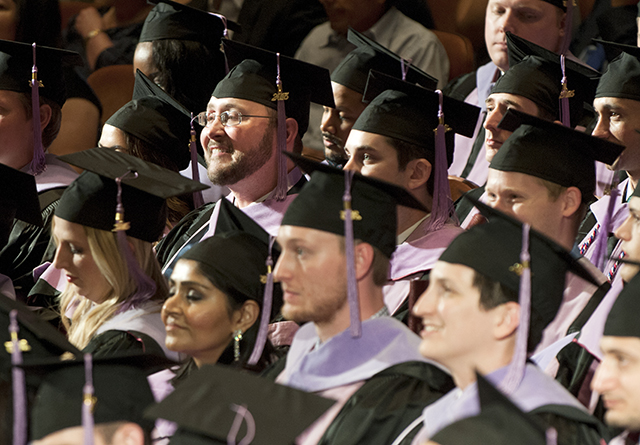 Graduates sit in their seats during commencement exercises on May 27 at the Morton H. Meyerson Symphony Center in Dallas