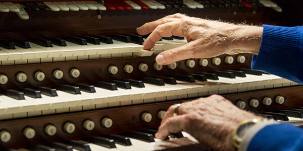 Dr. Bill Hanson, '61, plays a theater organ in his Dallas home.