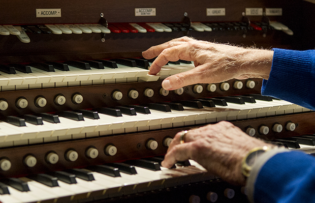 Dr. Bill Hanson, '61, plays a theater organ in his Dallas home.