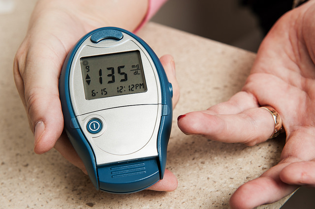 A finger pricked by a glucometer