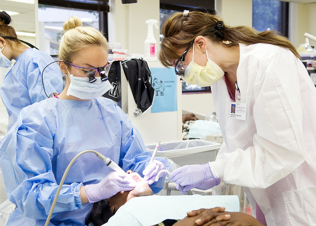 Leah Spittle, right, instructs dental hygiene student Mary Ashley Taber.