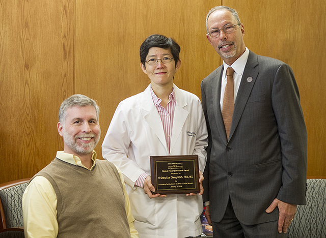 Left to right: Dr. Douglas Benson, Dr. Yi-Shing Lisa Cheng, Dean Lawrence Wolinsky