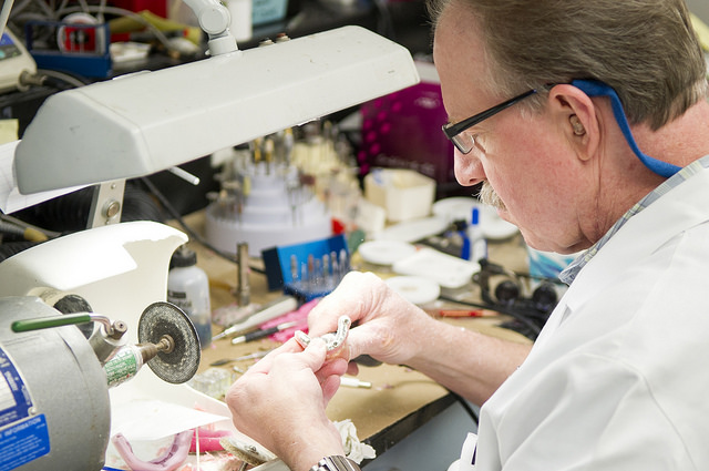 Steve Ruff works in the lab at the college's Center for Maxillofacial Prosthodontics