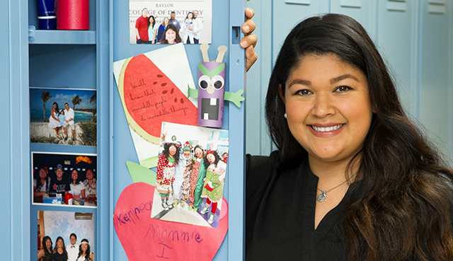 Photos of family members fill Dominique Salas-Garfias' locker at TAMBCD.