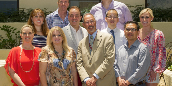 The Class of 2006 poses for a photo in the dental school's Atrium .