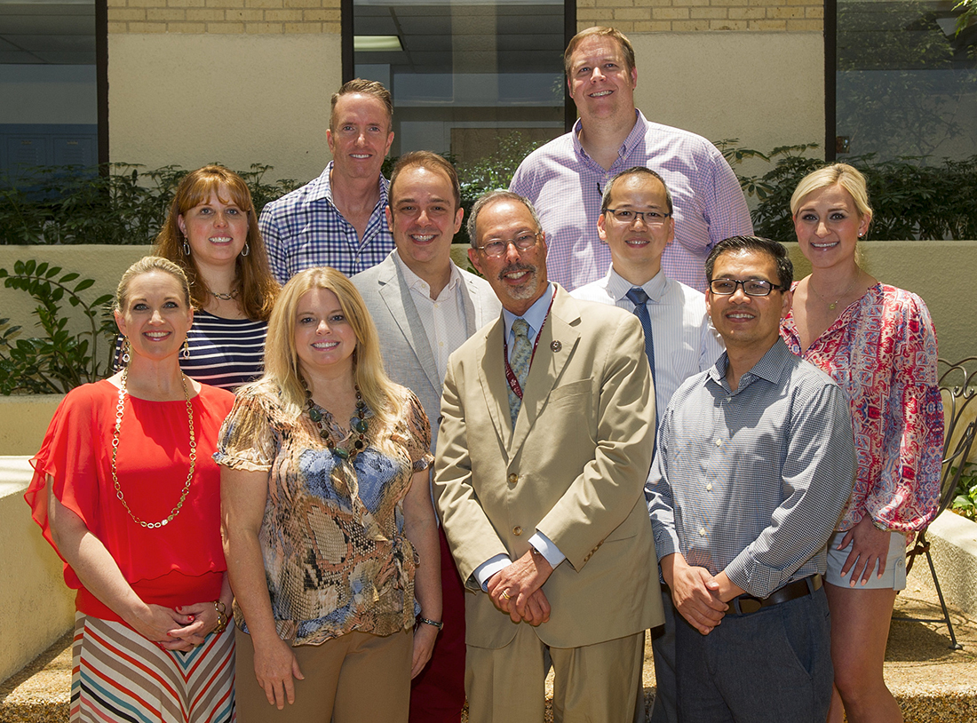 The Class of 2006 poses for a photo in the dental school's Atrium .