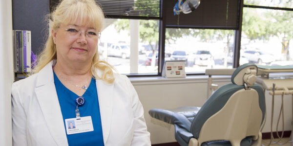 Linda Brock, program coordinator, stands in the clinic at the Center for Facial Pain and Sleep Medicine