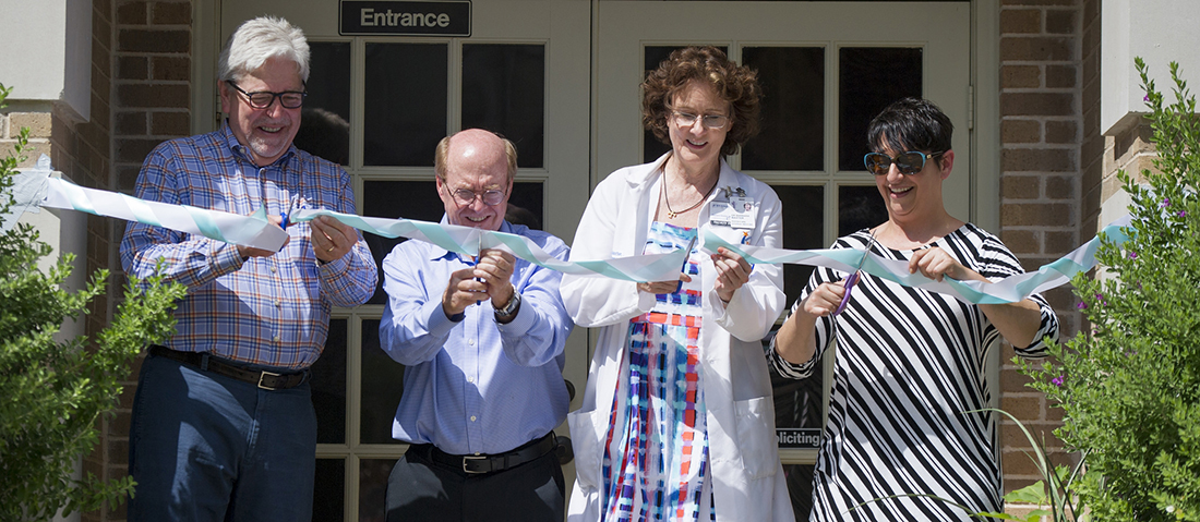 Paul Hoffmann with the dental school, second from left, along with Dr. Barbara Stark Baxter, founder, and Stephanie Bohan, executive director, during the ribbon cutting on June 25.