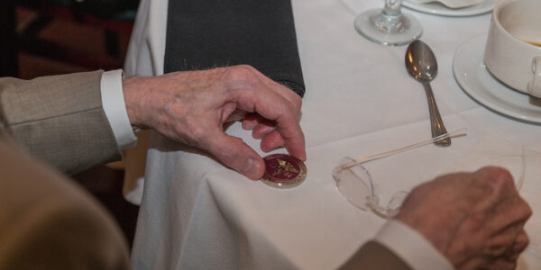 The Challenge Coin, like this one, above, is awarded each year during the Graduate Prosthodontics Annual Recognition Dinner.