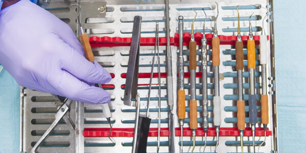 Dental tray, instruments and gloved hand