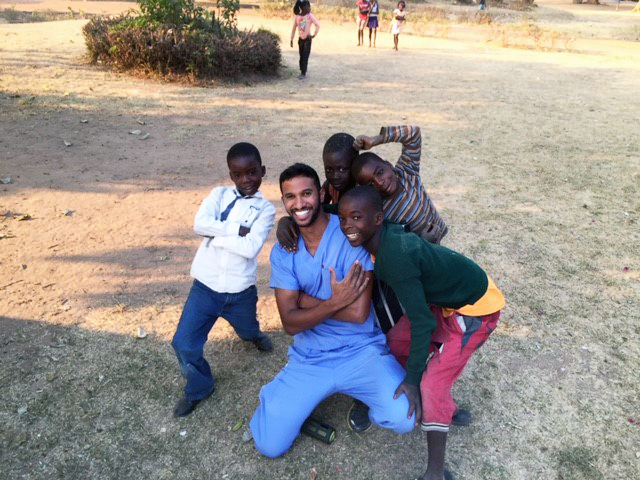 Dental student Keith Mahipala smiles with some young patients in Zambia.