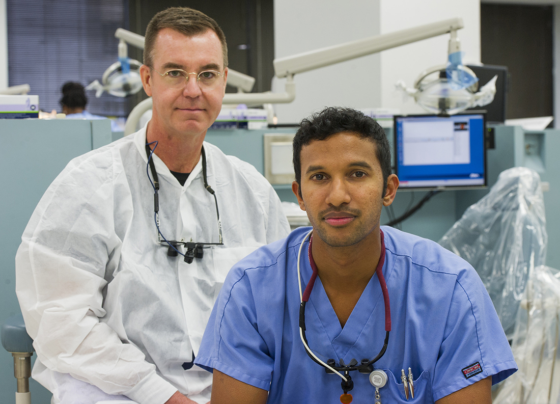 Shared responsibility: Dr. Brent Hutson (left) and dental student Keith Mahipala agree that dealing with diabetes begins the first time a patient steps foot in the clinic.