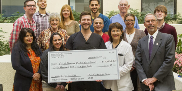 Texas A&M College of Dentistry dental students and area predental students presented a $12,000 check to college faculty, staff and administrators on Nov. 11.