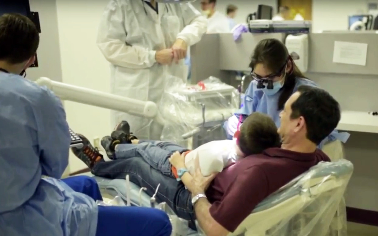 A parent and pediatric patient at Texas A&M College of Dentistry's Give Kids a Smile event