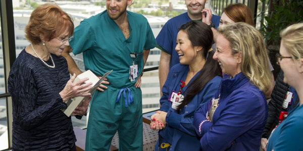 Dr. N. Sue Seale talks with pediatric dentistry residents during her March 29 retirement reception.