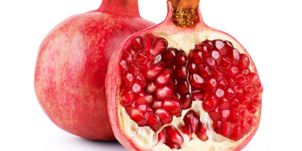 Ripe pomegranate fruit isolated on white background cutout