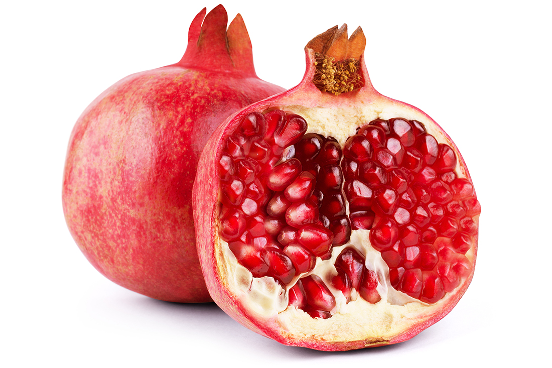 Ripe pomegranate fruit isolated on white background cutout