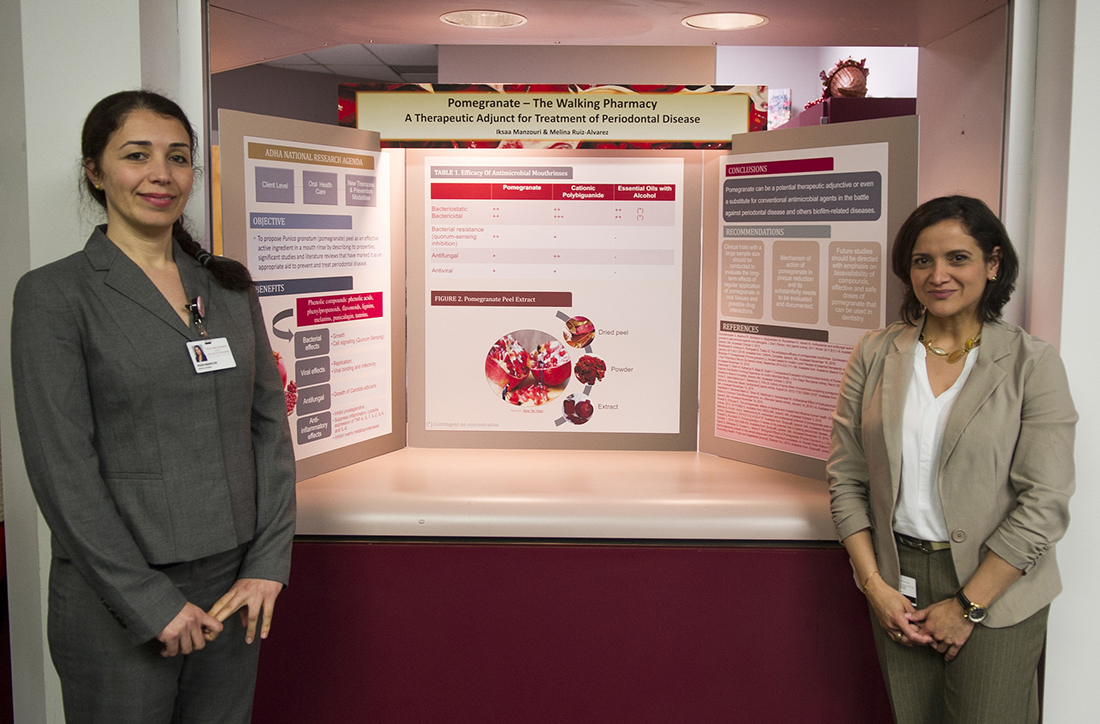 Iksaa Manzouri, left and Melina Ruiz-Alvarez with their table clinic findings during the April 5 Research Scholars Day at Texas A&amp;M College of Dentistry