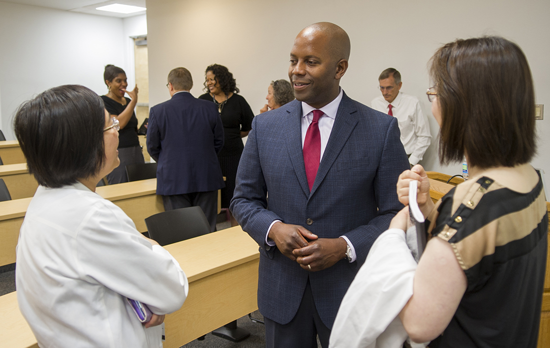 Williams speaks with Texas A&M College of Dentistry faculty members on June 21.