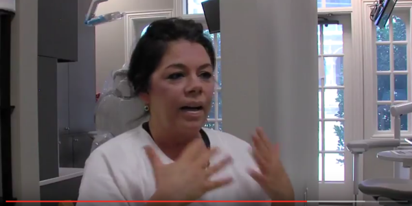 Screenshot of the video. A woman being interviewded.