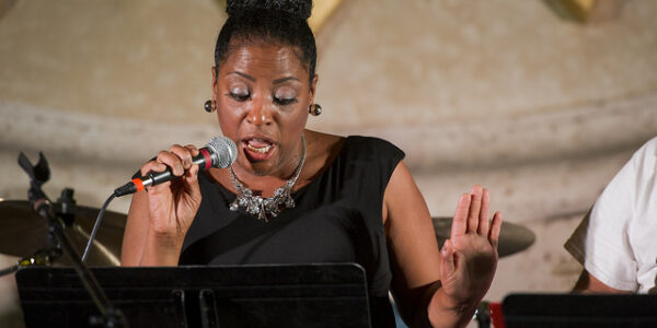 LaDawn Brock, marketing, web and media relations manager, sings "Loco-motion" during the Nov. 17 Agape benefit concert.