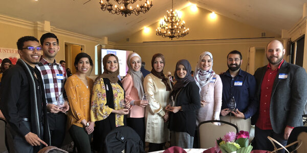 L to R: D3 Twain Henry; D3 Husnain Shahid, D2 Salma Haneef; D4 Deanna Ayyash; D4 Duaa Omar; Clinical Assistant Professor Dr. Amal Noureldin; D4 Jawairia Waheed; D3 Lina El-Kashef; D4 Zaki Razvi; and D3 Amjad Saleh.