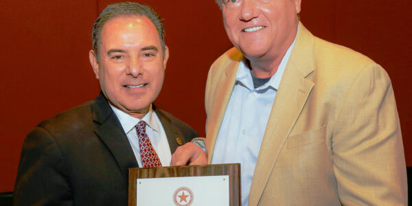 Dr. Michael Bell, right, with Dr. Jose "Joey" Cazares '85, past president of the Texas Dental Association