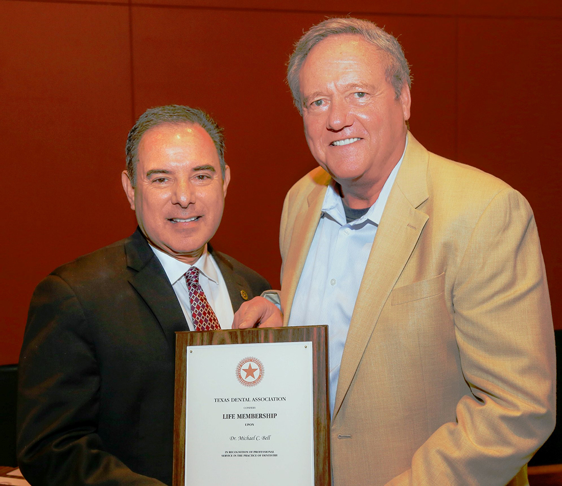 Dr. Michael Bell, right, with Dr. Jose "Joey" Cazares '85, past president of the Texas Dental Association