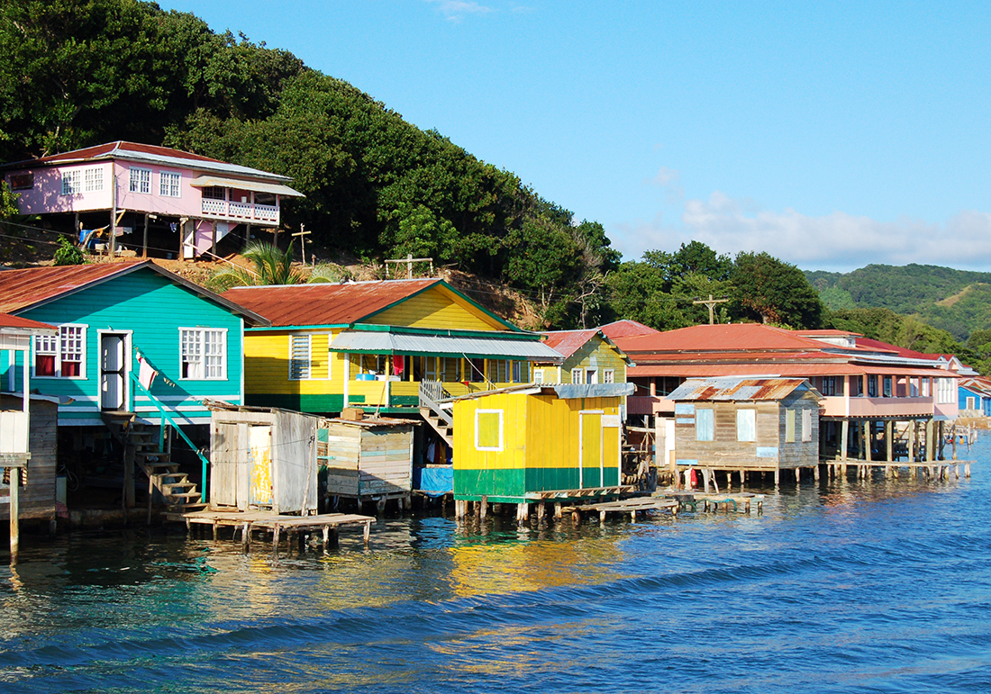 Houses built on stilts along the coast of Roatan, Honduras