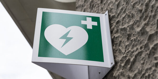 Automated External Defibrillator Emergency Sign Mounted on a Wall