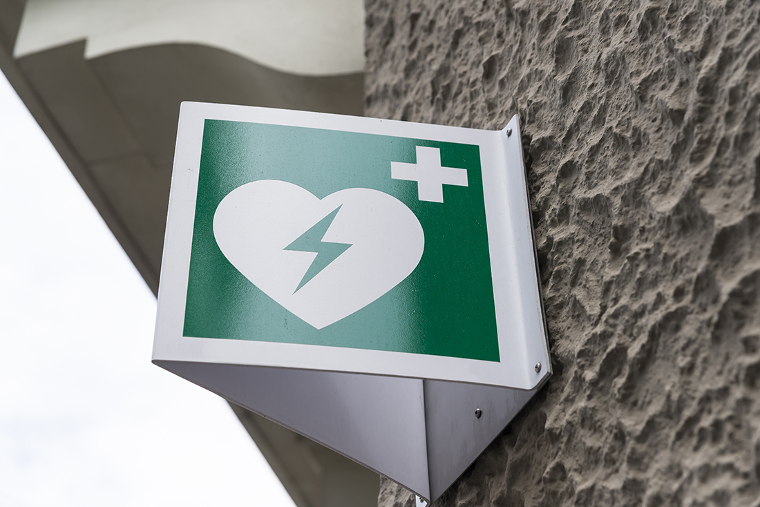 Automated External Defibrillator Emergency Sign Mounted on a Wall