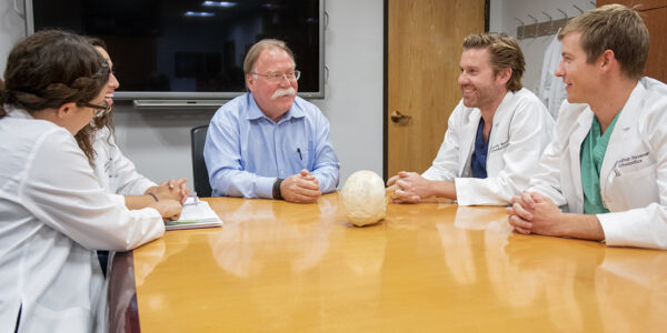 Dr. Peter Buschang talks with third-year orthodontic residents.