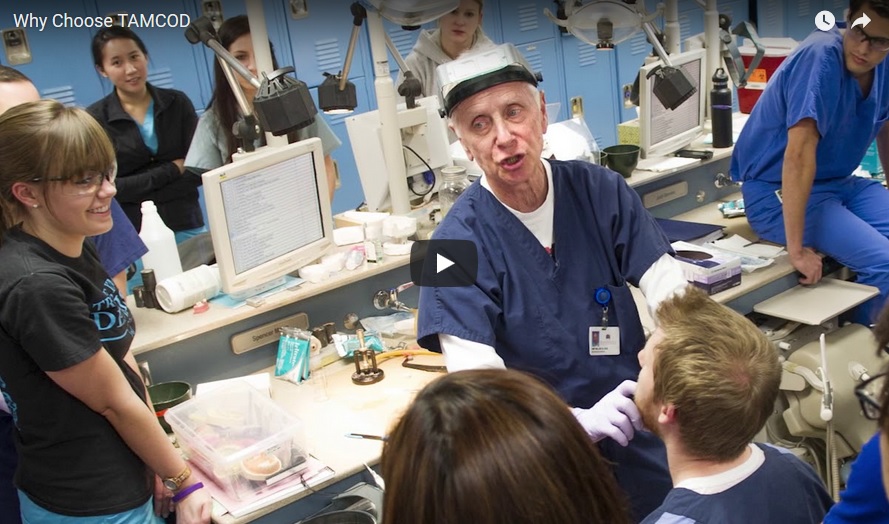 Dr. Amp Miller III talks with dental students during one of their preclinical lab courses.