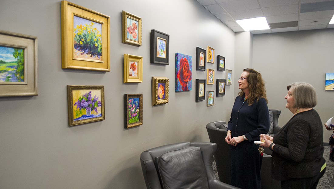 Dr. Ann McCann, left, with her close friend and colleague Pat Campbell, professor and executive director of dental hygiene, at the February 2016 opening of “The Color of Memories” exhibit featuring McCann’s artwork at the Baylor Health Sciences Library