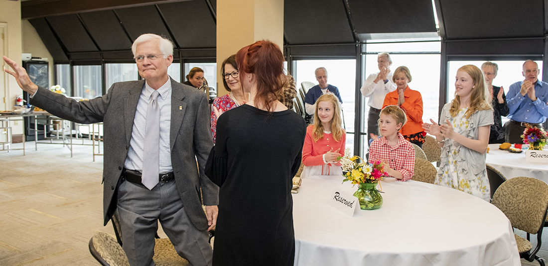 Family, friends and colleagues join in honoring Dr. Charles Berry at his retirement reception.