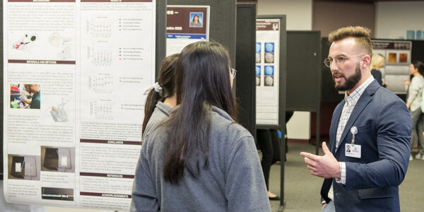 Brenden Manley discusses his winning project at Research Scholars Day.