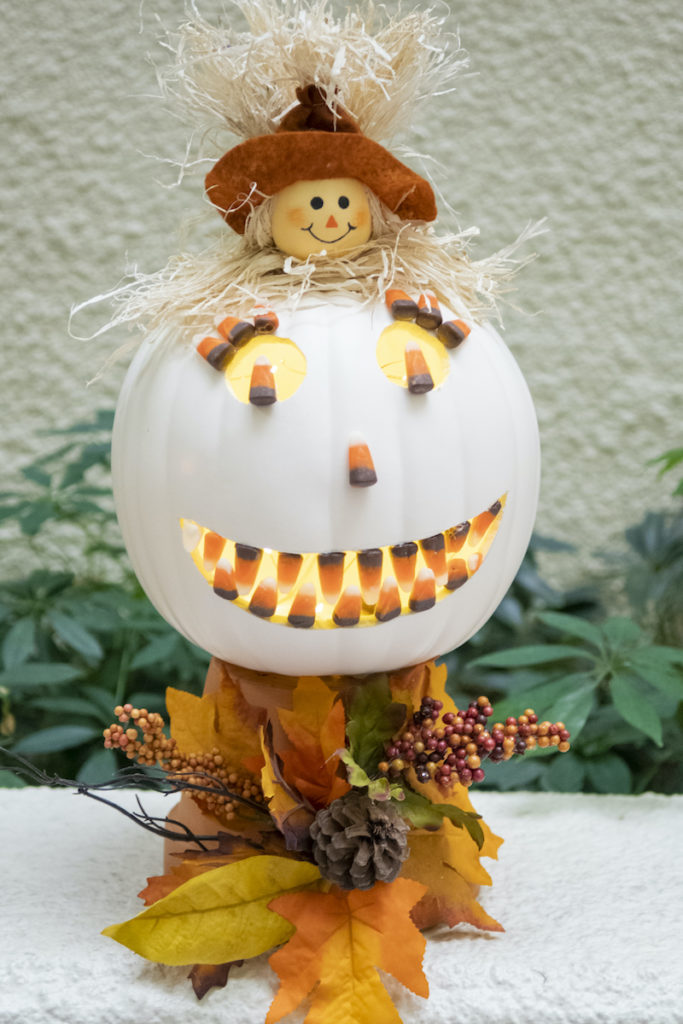 Carved pumpkin with candy corn grin