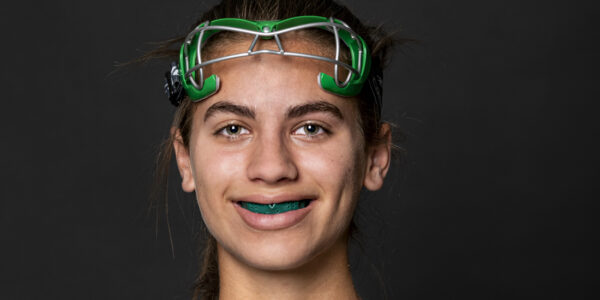 High school student Camille Green hardly notices her mouthguard while playing on the field hockey team for The Hockaday School in Dallas.